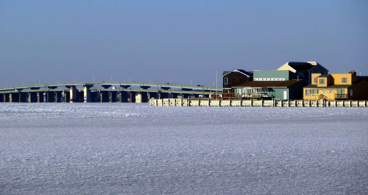  The frozen Barnegat Bay and the Mathis Bridge in the background as seen from Seaside Park on Jan. 7, 2014 by Kevin Michelson. 