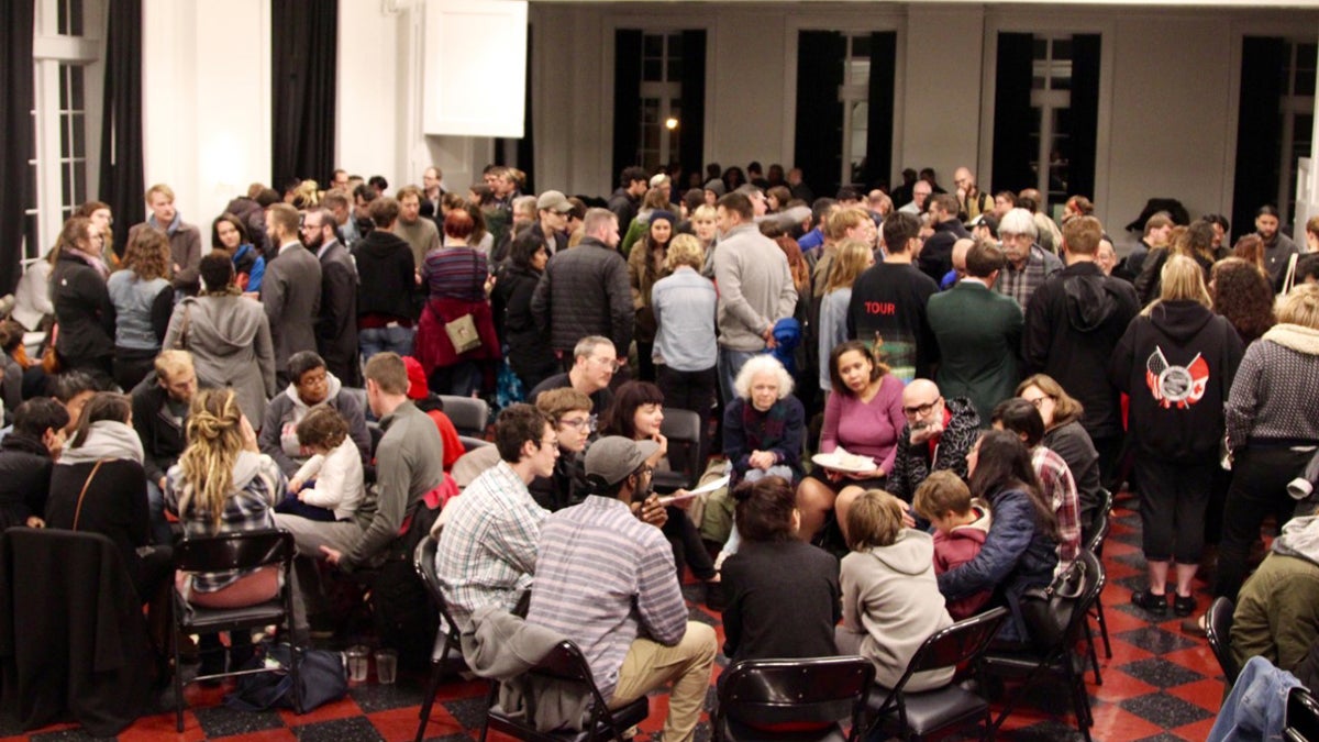 More than 200 people attended a Trump protest meeting in Pittsburgh Wednesday night at the Ace Hotel. Organizers said they ran out of sign-up sheets until a volunteer handmade more and ran to make more copies. (Katie Blackley / 90.5 WESA)