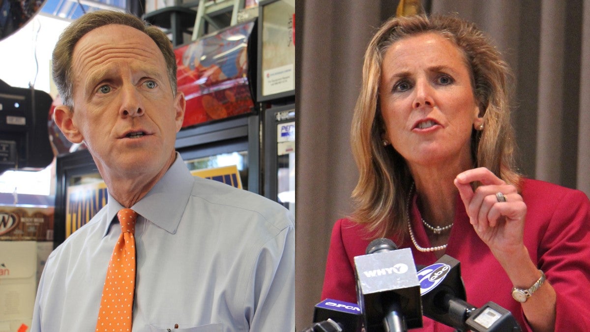 Republican Sen. Pat Toomey (left) and Democratic Senate candidate Katie McGinty on the campaign trail in Philadelphia.  (Emma Lee/WHYY)