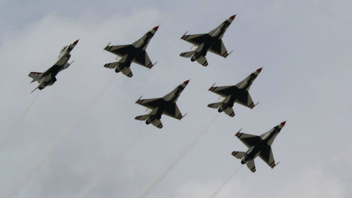 The U.S. Air Force Thunderbirds fly at Joint Base McGuire-Dix-Lakehurst in New Jersey in 2014. (Mark Eichmann/WHYY)