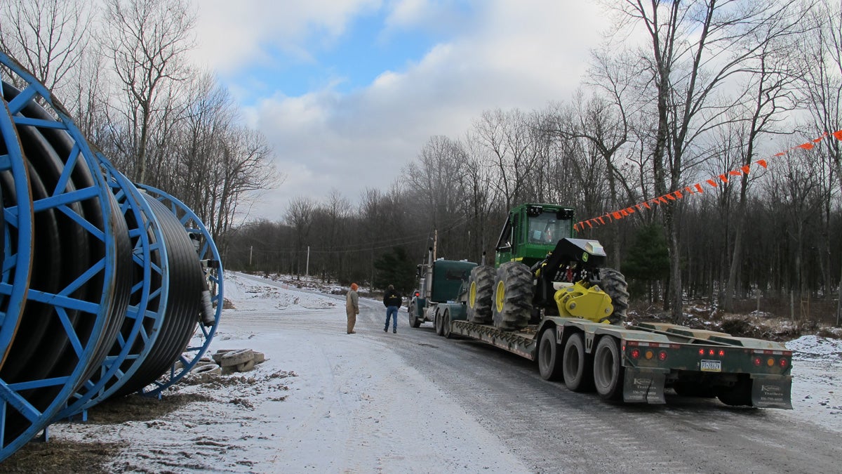  A truck moves heavy equipment through the Tiadaghton State Forest in Lycoming County. (Marie Cusick/StateImpact Pennsylvania) 