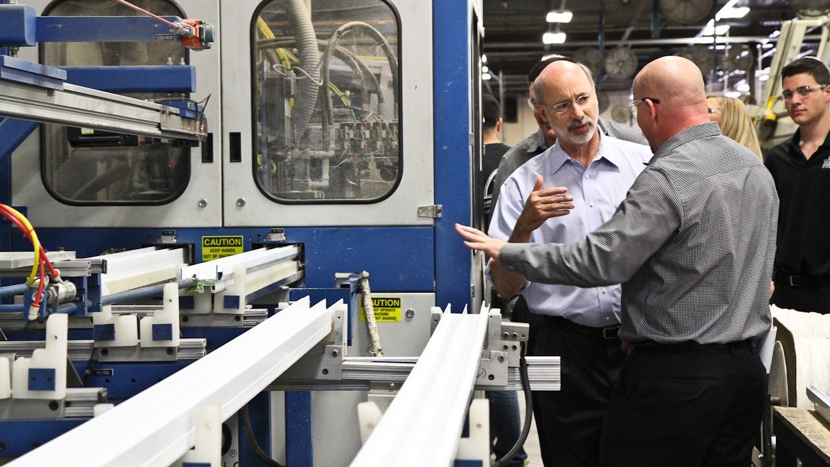 Pa. Gubernatorial Candidate Tom Wolf tours the Northeast Building Products factory in Northeast Philadelphia. (Kimberly Paynter/WHYY)