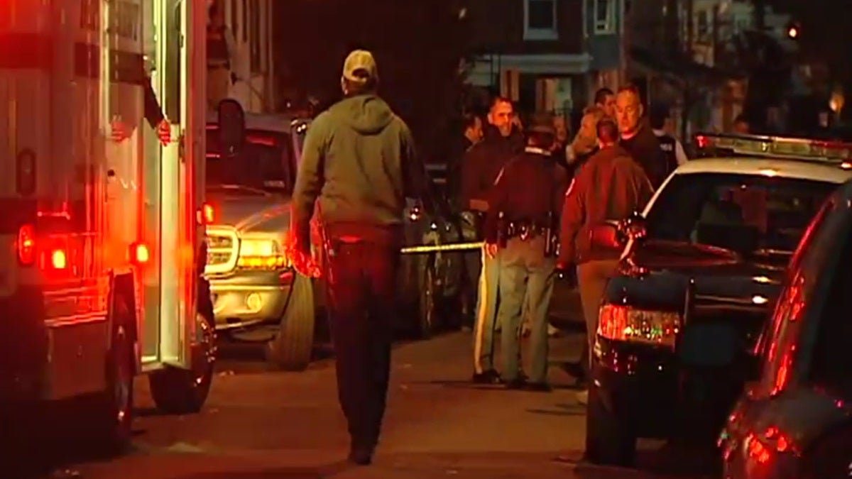  Police gather in Wilmington last November after a State Trooper was shot. (WHYY/File) 