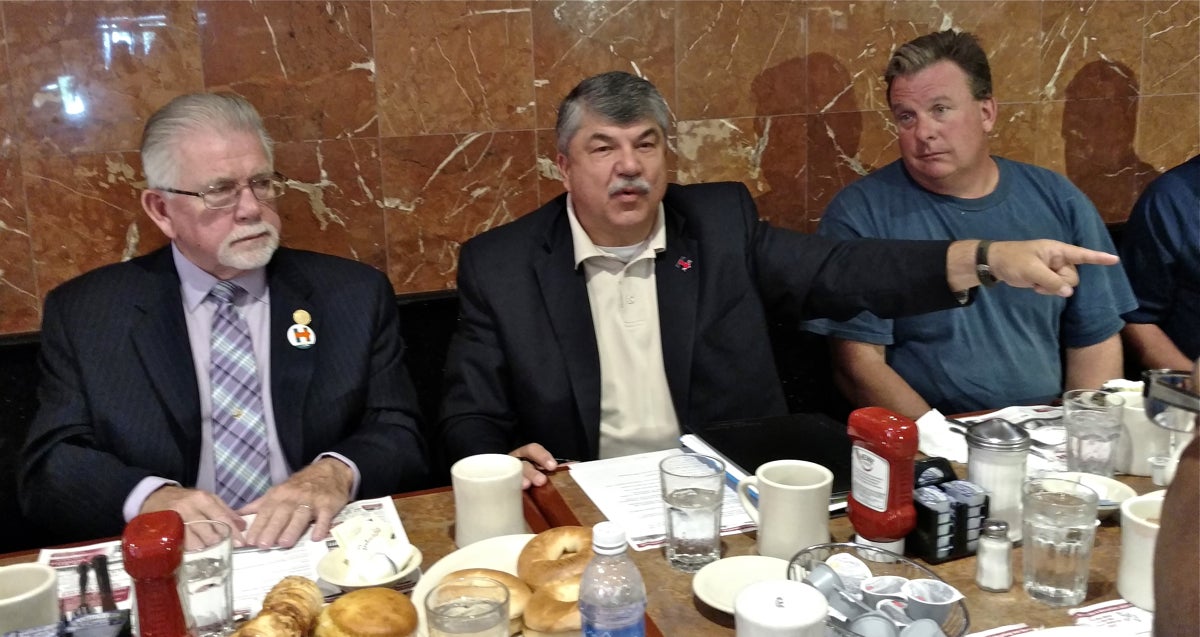 The AFL-CIO's national president Richard Trumka (center)was at the Oregon Diner in South Philadelphia Wednesday morning to stump for Democratic nominee Hillary Clinton at a roundtable with 14 local union workers. (Katie Colaneri/WHYY)