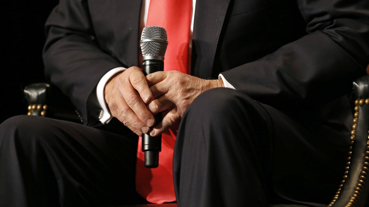 Republican presidential candidate Donald Trump is shown holding a microphone at a 2016 campaign event (AP Photo/Patrick Semansky