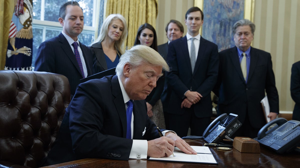 President Donald Trump signs an executive order on the Keystone XL pipeline