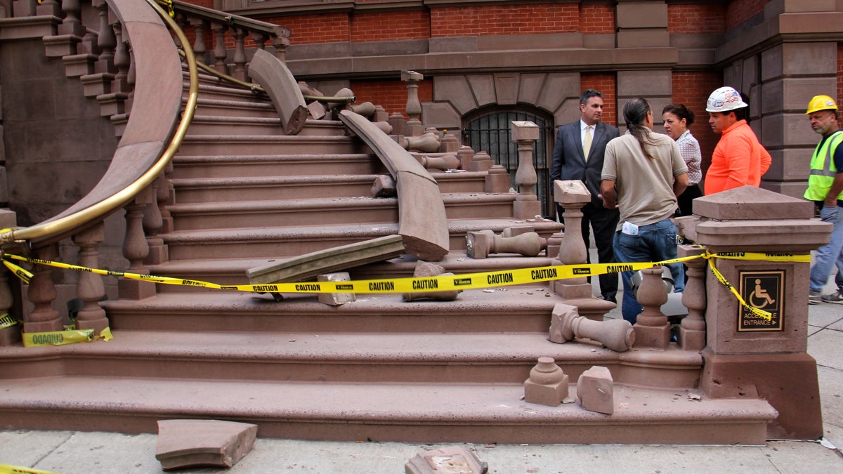 Workmen evaluate damage to the Union League staircase. (Emma Lee/WHYY)