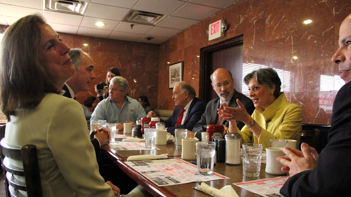  Democratic leaders meet to throw their support behind gubernatorial nominee Tom Wolf. Pictured are (from left) Katie McGinty, Sen. Bob Casey, U.S. Rep. Bob Brady, former Gov. Ed Rendell, Wolf, U.S. Rep. Allyson Schwartz, and state party leader Jim Burn. (Emma Lee/WHYY) 