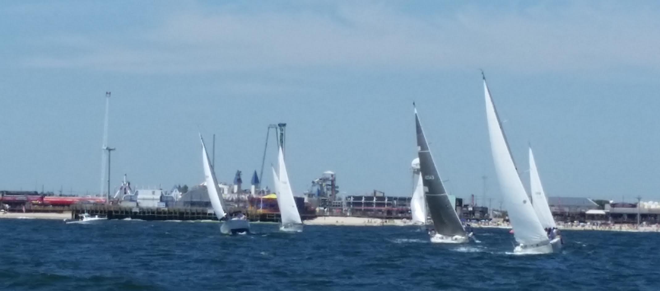  Sailboats racing in the third annual JetStar Regatta rounding the mark located near the final resting spot of the JetStar roller coaster off Seaside Heights and heading back up the beach to the finish at the Manasquan Inlet. (Image courtesy of Mark Connell) 