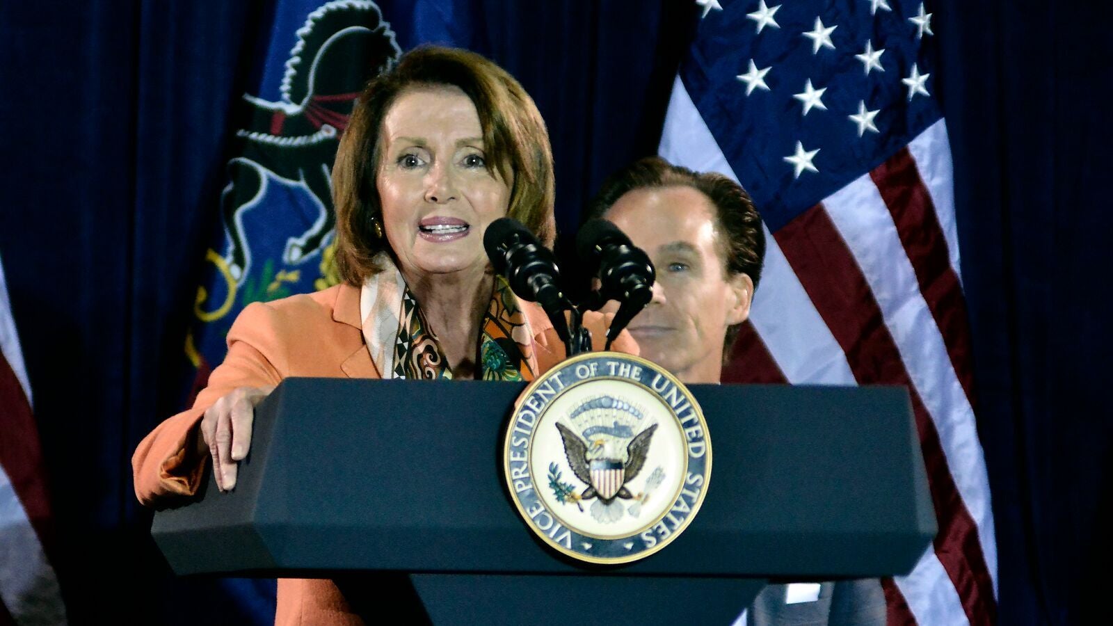 U.S. House Minority Leader Nancy Pelosi speaks to a crowd at the Sheet Metal Workers Union Hall in Philadelphia Monday night. She and Vice President Joe Biden are urging city Democrats to give Hillary Clinton a landslide victory. ( (Bastiaan Slabbers/for NewsWorks)