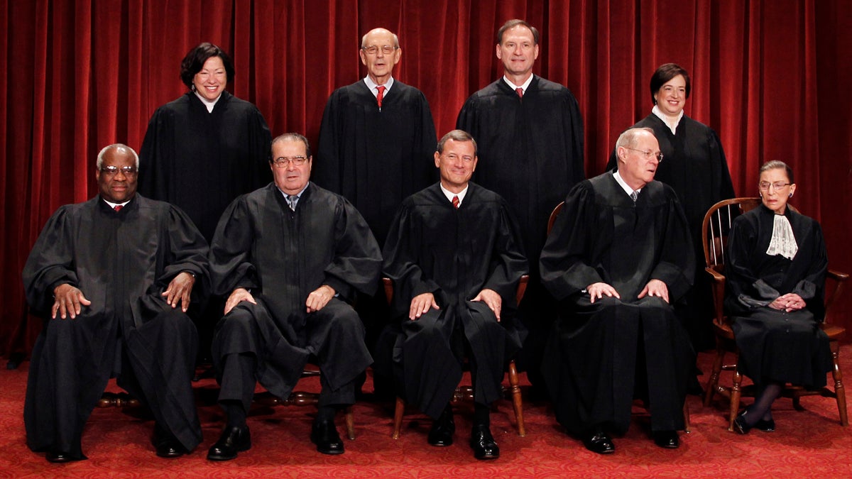  Chief Justice John Roberts is shown (front row, center) with the Associate Justices (back row) Sonia Sotomayor, Stephen Breyer, Samuel Alito Jr., (front row) Clarence Thomas, Antonin Scalia, Anthony Kennedy and Ruth Bader Ginsburg. (AP Photo/Pablo Martinez Monsivais) 