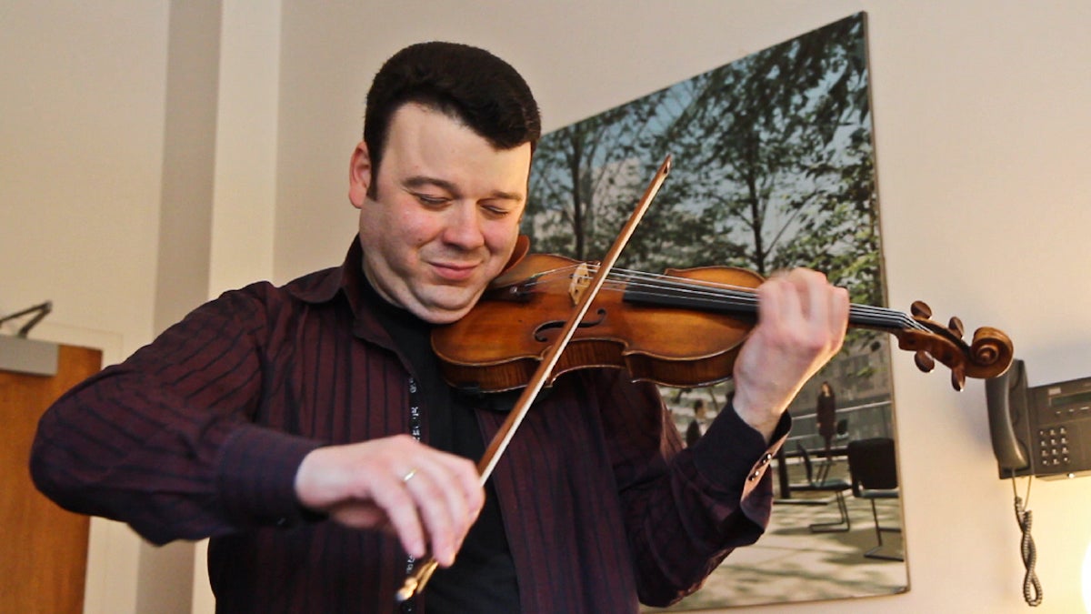 Vadim Gluzman performs an excerpt of Tchaikovsky's Violin Concerto on the instrument it was written for in his dressing room after rehearsal Wednesday with the Philadelphia Orchestra. (Kimberly Paynter/WHYY) 