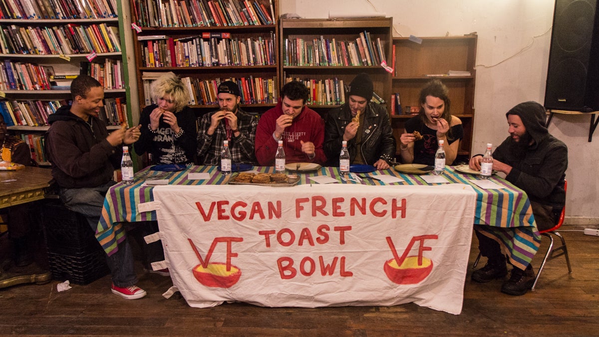 Eaters compete to win a haircut and free food at the 3rd annual Vegan French Toast Bowl at Lava Space in West Philadelphia. (Kimberly Paynter/WHYY)