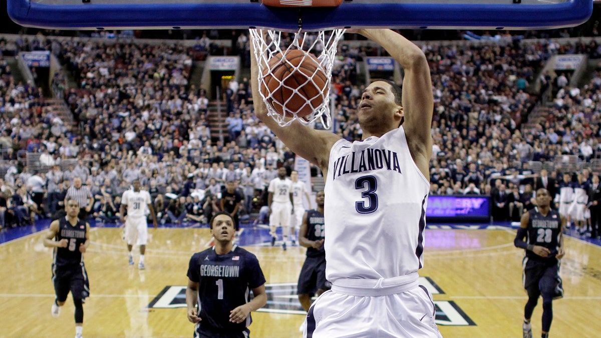 Villanova's Josh Hart dunks the ball during the first half of an NCAA college basketball game against Georgetown