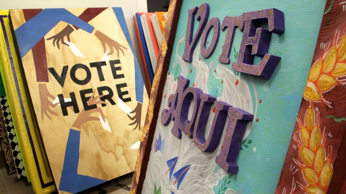  Local artists created signs to encourage voter participation. (Emma Lee/WHYY) 