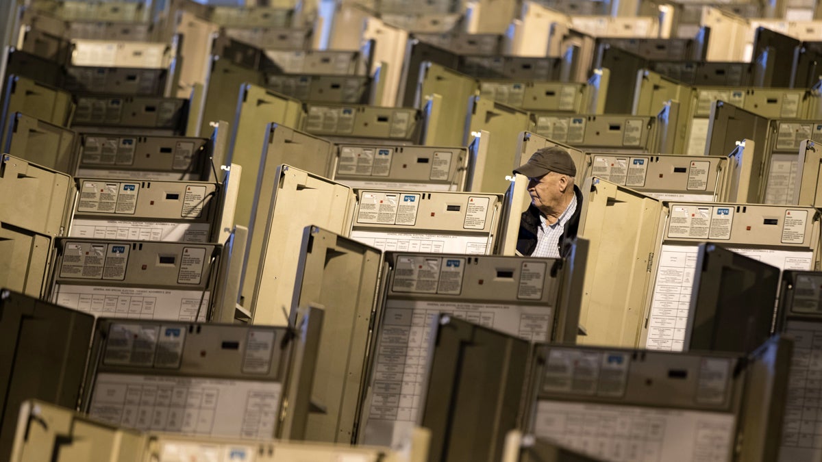 A technician is shown in October working to prepare voting machines to be used in the presidential election