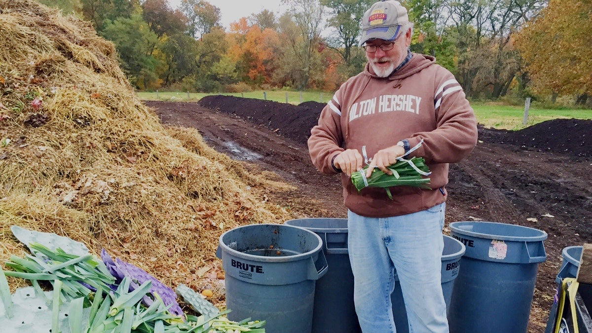  Scott Blunk sorts through additions to the compost at the W.B. Saul High School farm. (Neema Roshania Patel/WHYY) 