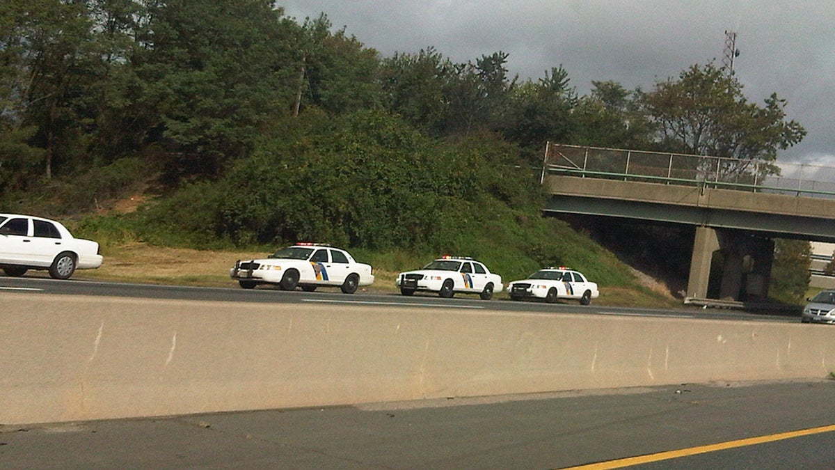 New Jersey State Troopers parked along the shoulder of a New Jersey roadway (Image courtesy of Wikimedia Commons)