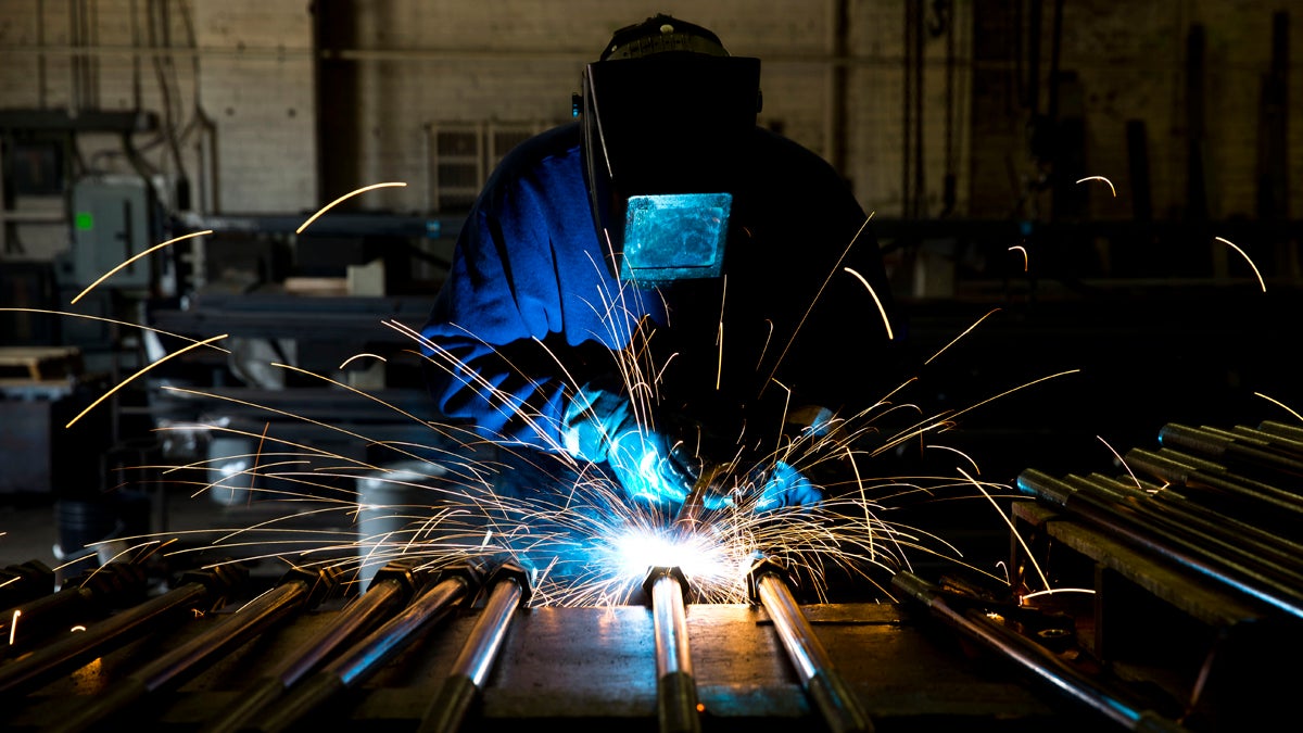 In this file photo, a welder fabricates anchor bolts for roads and bridges at the custom manufacturer in Pennsylvania.  (AP Photo/Matt Rourke) 