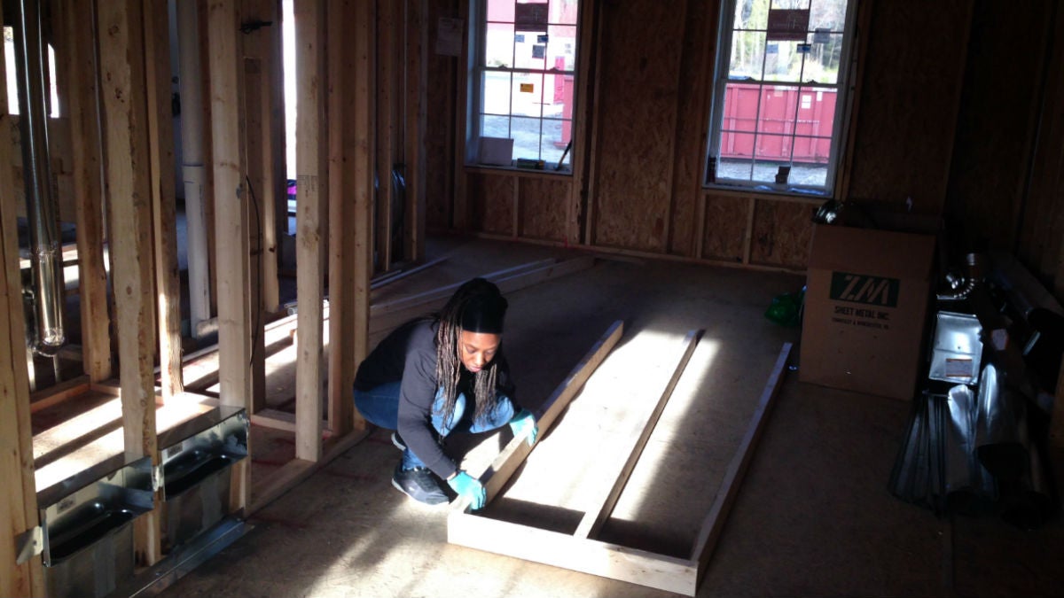 west-169 Amanda West works inside the home she's helping to build for her family in Georgetown. (Mark Eichmann/WHYY)