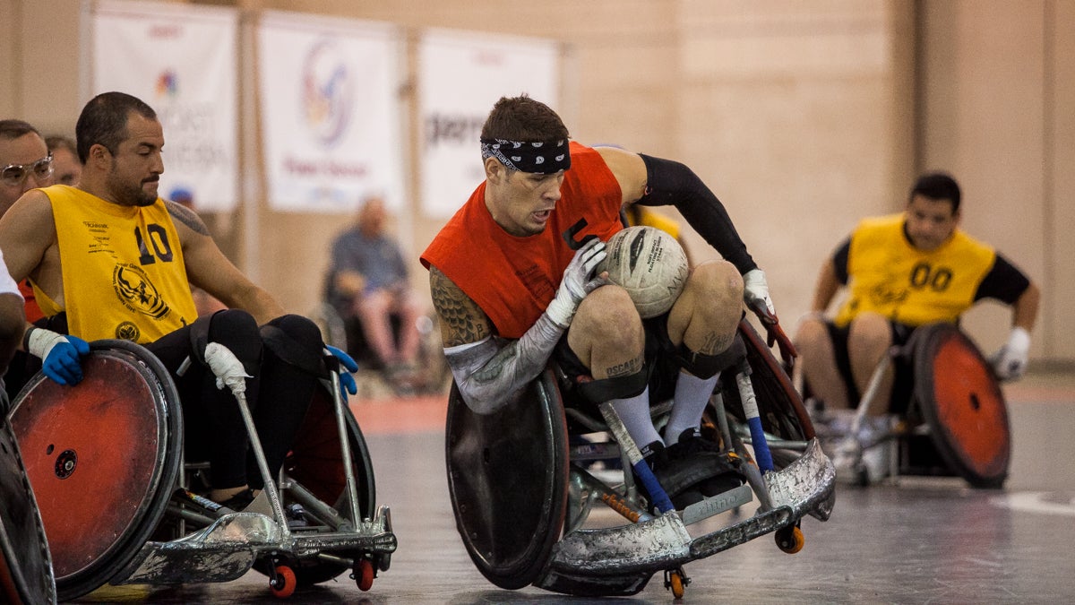  Mason Symons nearly tips his chair in a run to the goal during the championship rugby game at the National Veterans Wheelchair Games. (Brad Larrison/for NewsWorks) 