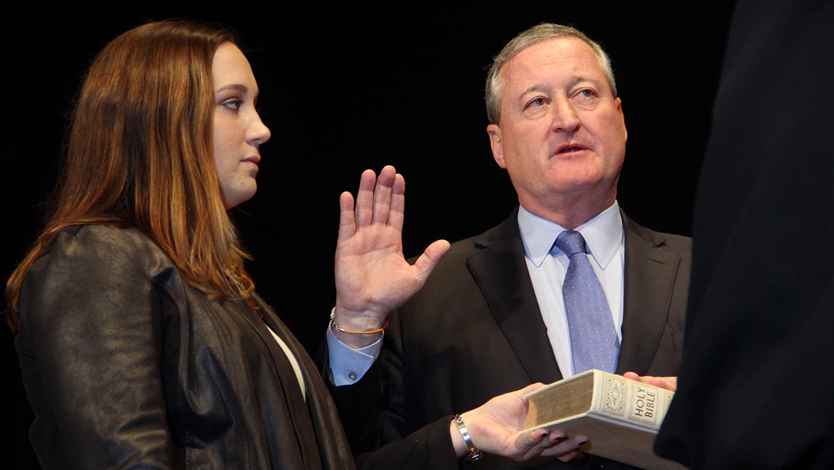  Jim Kenney is sworn in as mayor at the Academy of Music while his daughter Nora holds the Bible. (Emma Lee/WHYY) 