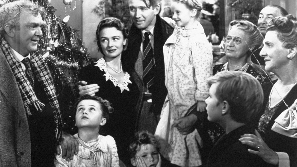  James Stewart, center, is reunited with his wife, Donna Reed, left, and children during the last scene of Frank Capra's 