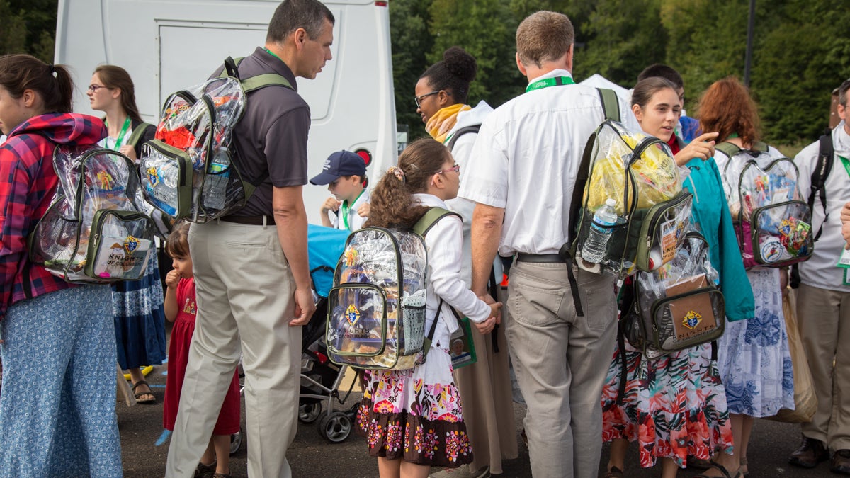 Over 700 people que up at the Woodbourne SEPTA train station on their way into the city to see Popr Francis speak from the steps of the Philadelphia Art Museum. Over 1000 visitors will pass through this station today on their way to the various World Meeting of Families 2015 events in the heart of Phladelphia. (Emily Cohen/for NewsWorks)