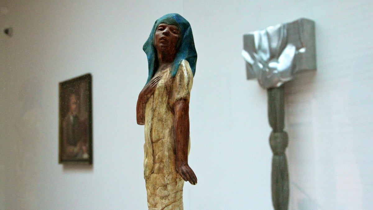  A statuette by Meta Vaux Warrick Fuller (1914) is juxtaposed with Barbara Chasea-Riboud's Time Womb (1970)  in the Woodmere Art Museum's look at black artists in Philadelphia. (Emma Lee/WHYY) 