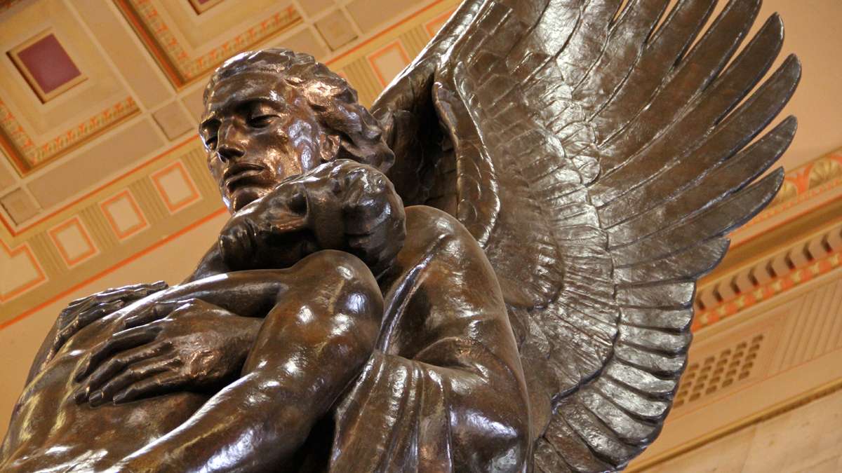  The Pennsylvania Railroad World War II Memorial by Walter Hancock depicts an angel raising a fallen soldier from the flames of war. (Emma Lee/for NewsWorks) 