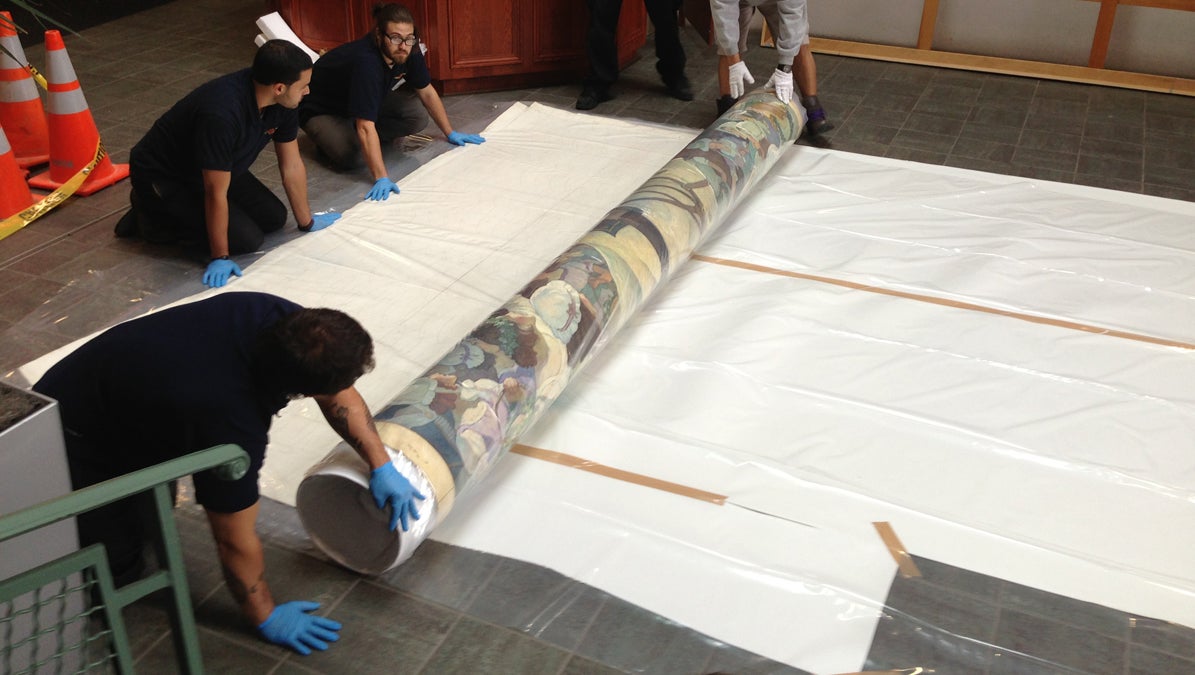  Workers unroll a mural of George Washington by N.C. Wyeth to be displayed at Thomas Edison State College in Trenton, New Jersey.  (Image courtesy of Thomas Edison State College) 