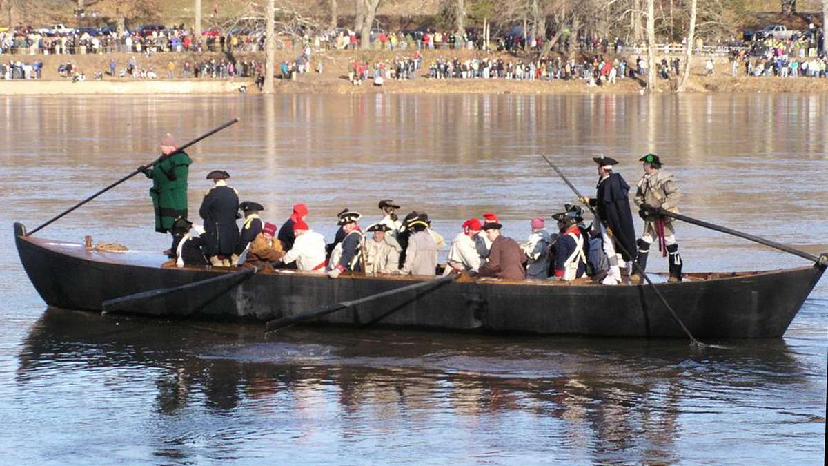  Reenactors make their way across the Delaware in very deep boats, making it appear that the rowers are sitting. (Photo courtesy of Kathleen Pasko) 