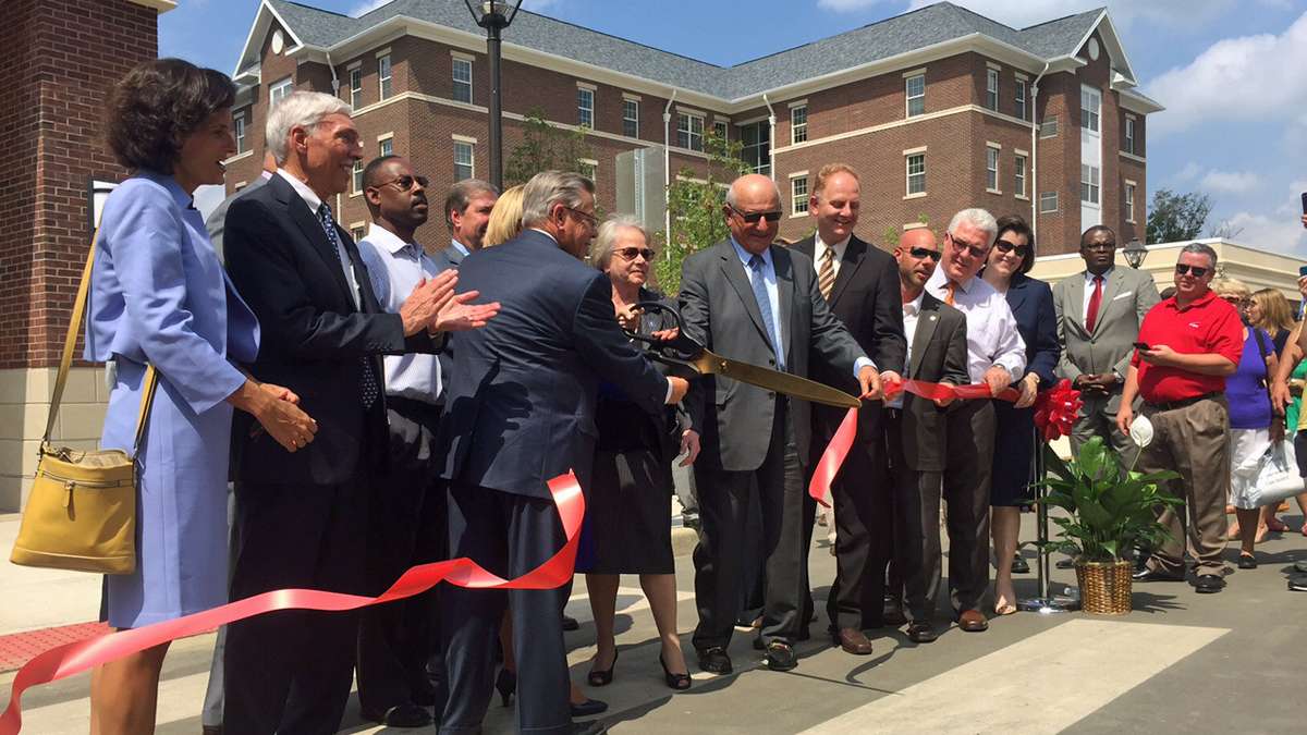  The red ribbon was cut at The College of New Jersey's 'Campus Town' project on Aug 19, 2015. (Alan Tu/WHYY) 