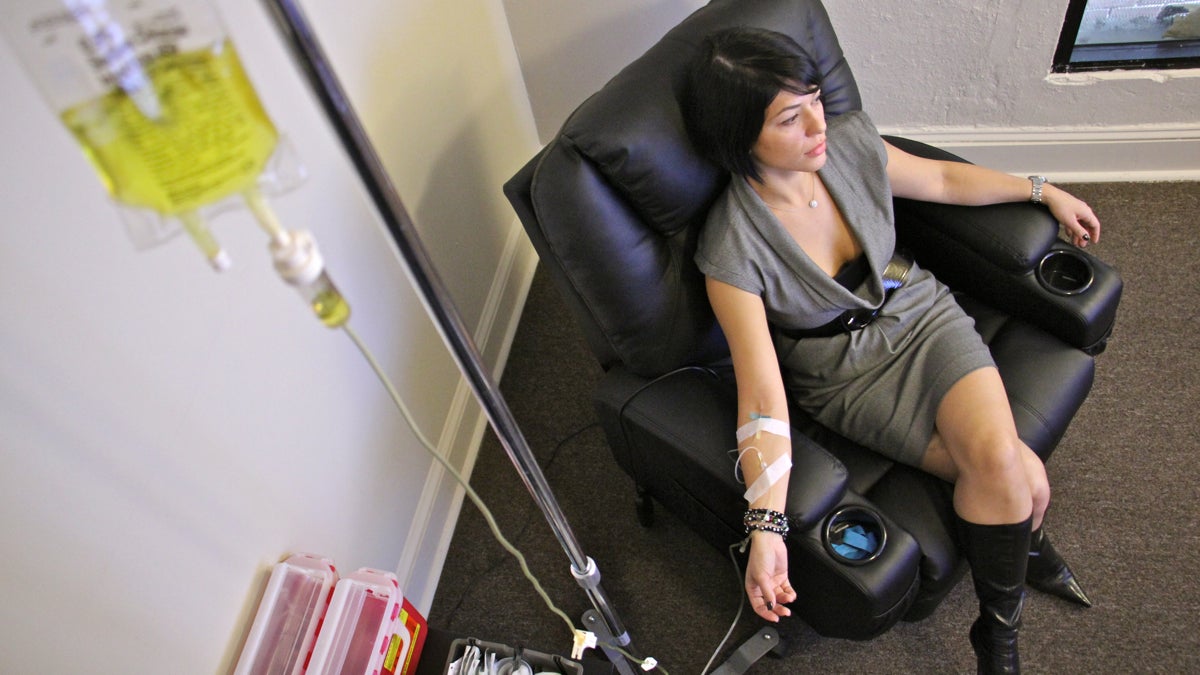 Yana Shapiro relaxes while taking a vitamin IV at RestoreIV (Emma Lee/WHYY)