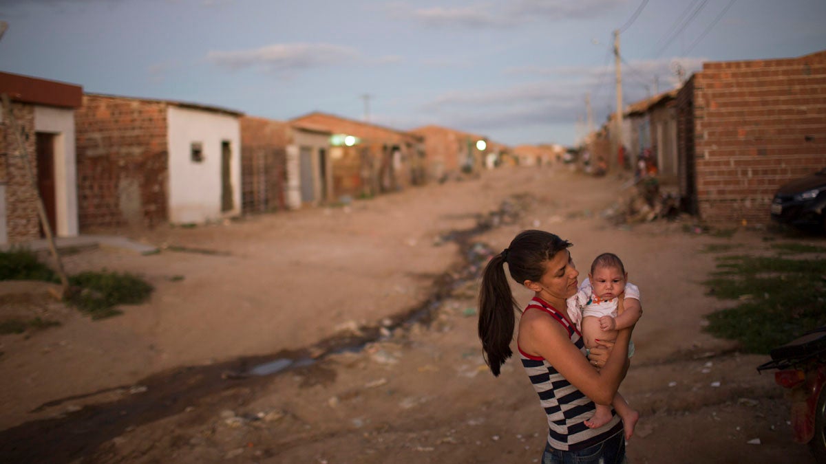 Angelica Pereira holds her daughter Luiza