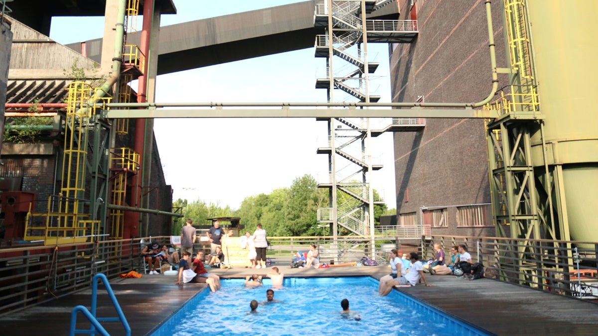  A swimming pool amidst the old structures at Zollverein, a former coal mine that was turned into a park and cultural space. (Marielle Segarra/WHYY) 