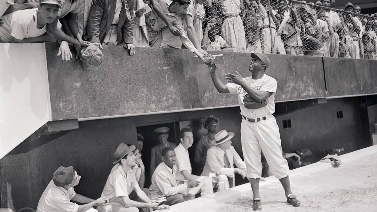  Jackie Robinson signs autographs at spring training with the Brooklyn Dodgers, March 06, 1948, part of “Chasing Dreams: Baseball and Becoming American,” opening March 13 at the National Museum of American Jewish History. (Photo courtesy of NMAJH) 