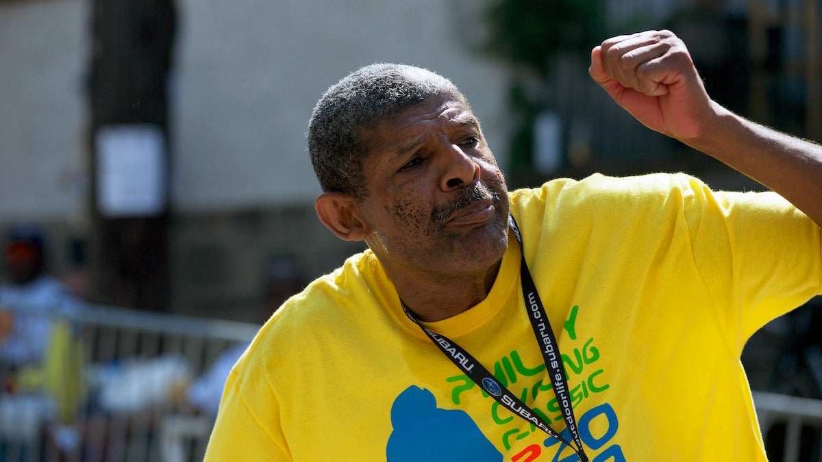  Volunteer Melvin Moore, shown here in 2013, cheers on bikers up and down the stretch where the gradient peaks. (Bas Slabbers/for NewsWorks, file) 