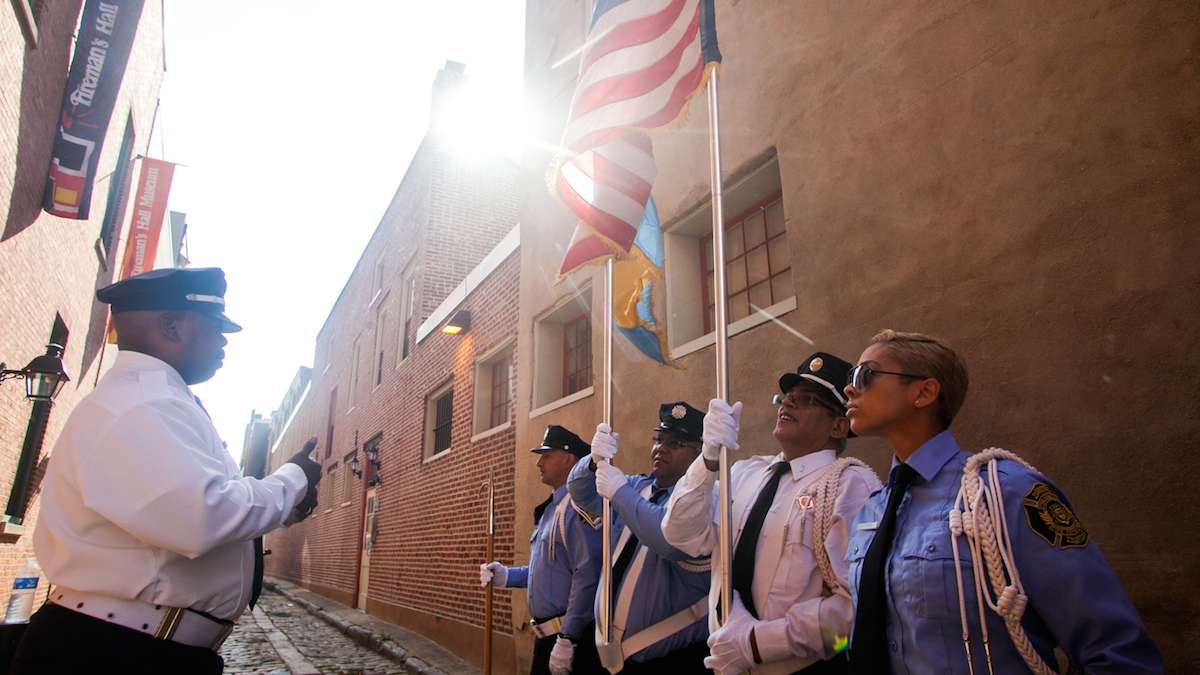 Members of the Philadelphia Fire Department Color Guard practice before marching on the 15th anniversary of the September 11th attacks on the World Trade Center.