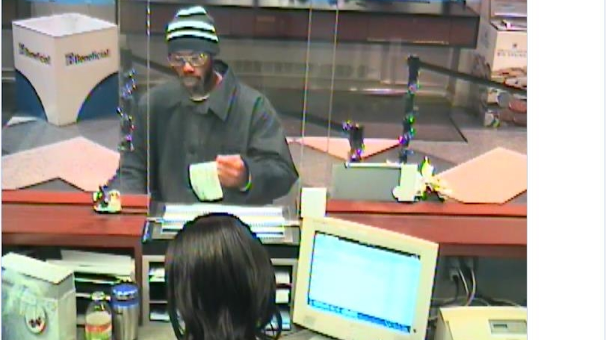  The suspect is seen here during an attempted robbery at a bank on 16th and Chestnut. Police believe he is the same man who robbed the Valley Green Bank at 7226 Germantown Ave. on Dec. 18. (Courtesy of the Philadelphia Police Dept.) 