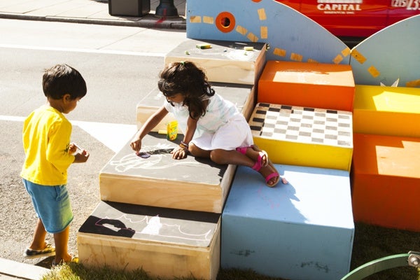 Children play on a Philadelphia parklet. (WHYY)