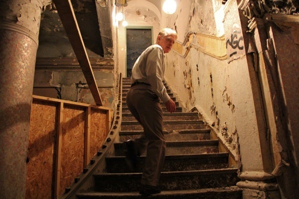 <p><p>Bill Deasey, director of leasing for EB Realty Management, leads visitors up the marble staircase of the Divine Lorraine. (Emma Lee/for NewsWorks)</p></p>
