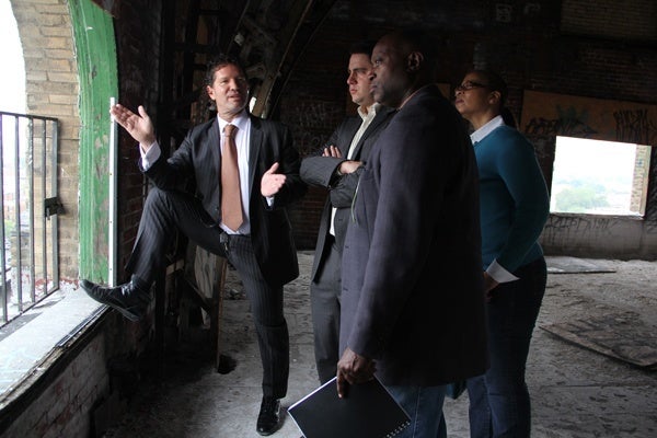 <p><p>Eric Blumenfeld (left) describes plans for improving the building's surroundings to George Farrell, special assistant to Pa. Sen. Lawrence Farnese; Masterman School parent Steven Bayne; and Karen Lewis, executive director of Avenue of the Arts, Inc. (Emma Lee/for NewsWorks)</p></p>
