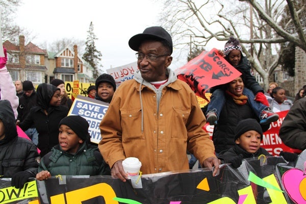 <p><p>ElVee Pryor, who has three children at Overbrook Elementary, joins the march to save the school. "They just spent over a half million dolllars to fix it up, now they're going to shut it down," he said. (Emma Lee/for NewsWorks)</p></p>
