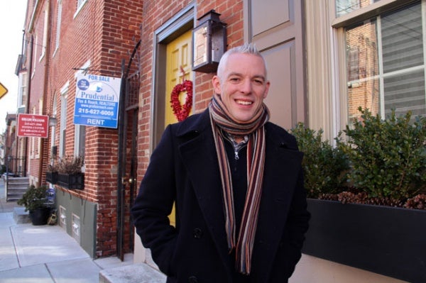 <p>Will Massey stands in front of his home in the Queen Village neighborhood, a section of the city that will see some of the highest tax increases. (Emma Lee/for NewsWorks)</p>
