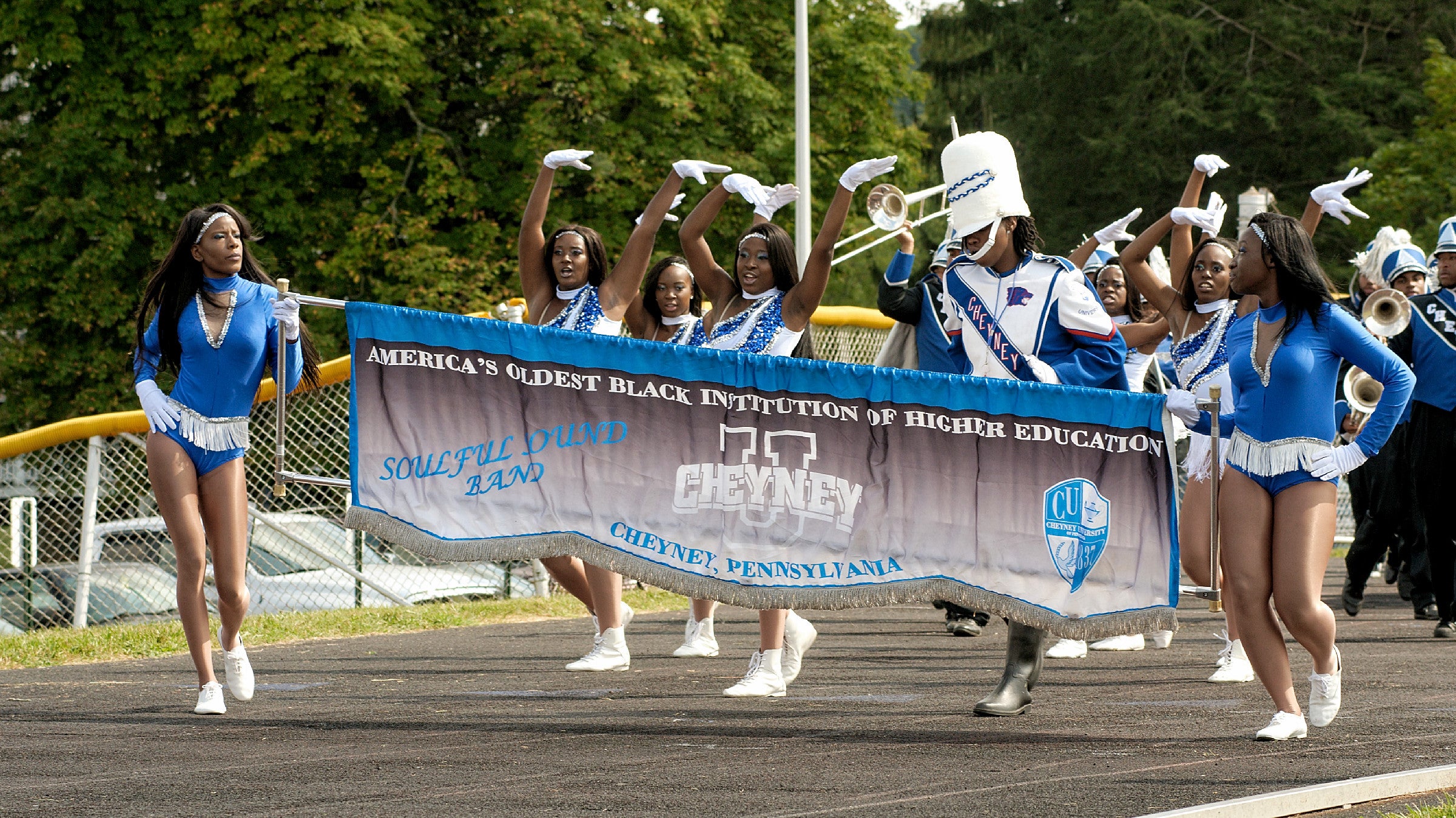  The cheer squad and marching band of Cheyney University take the field during half time at a football game against Lincoln University. (Bastiaan Slabbers/for NewsWorks) 