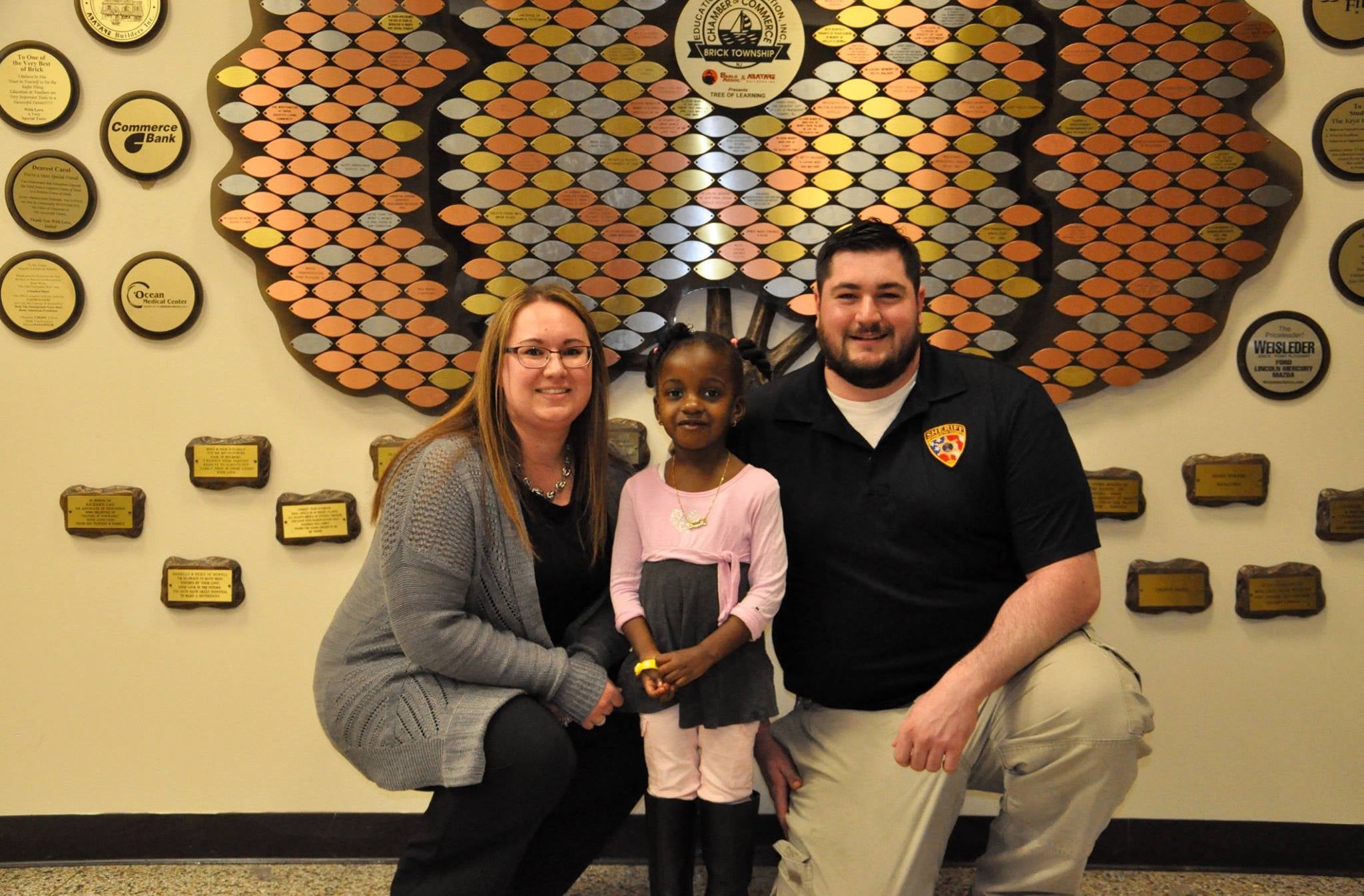  Kimberly Greenspan, Brick Township 911 Operator, and Public Safety Telecommunicator  Richard Incremona with the 3-year-old Brick Township girl who dialed 9-1-1 when she couldn't wake her mother. (Image courtesy of the Brick Township Police Department) 