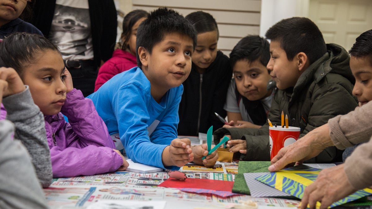 Alvaro, 10, asks a question during a comic book workshop in South Philadelphia. Mighty Writers El Futuro created a six-class comic book workshop to give their students a new outlet to talk about their fears after the 2016 election. (Emily Cohen for NewsWorks)
