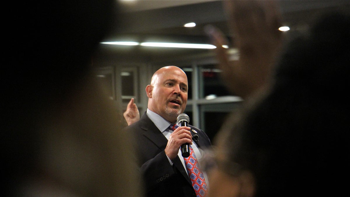 New Jersey Congressman Tom MacArthur faces a tough crowd in Willingboro. (Emma Lee/WHYY)