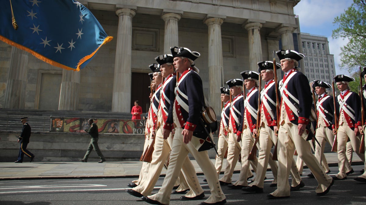 Members of The Old Guard, 3rd U.S. Infantry Regiment, march down Chestnut Avenue to the Museum of the American Revolution. (Emma Lee/WHYY)